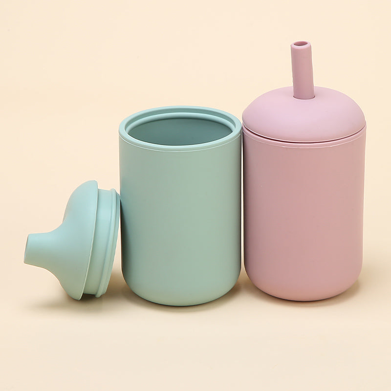 Vasos de silicona para bebés con bombilla y boquilla antiderrame en colores pastel verde y rosado