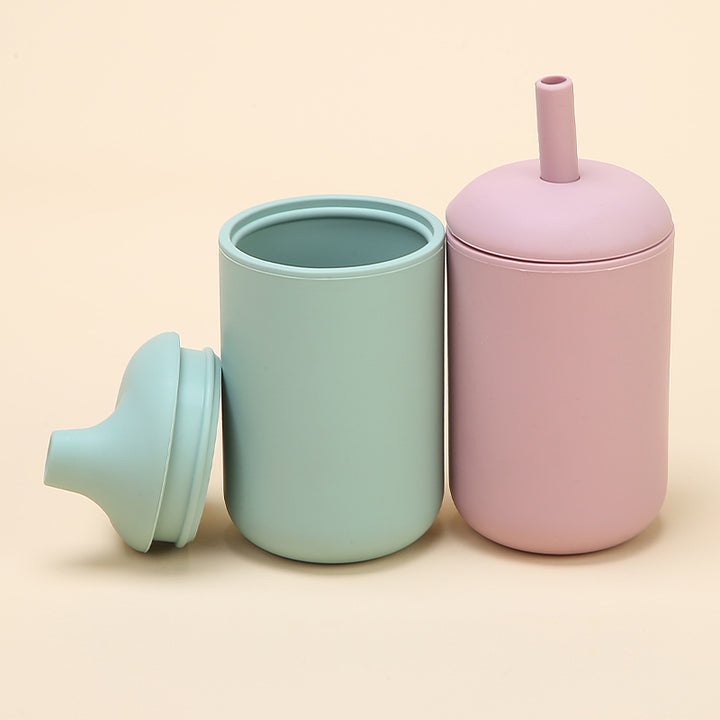Vasos de silicona para bebés con bombilla y boquilla antiderrame en colores pastel verde y rosado