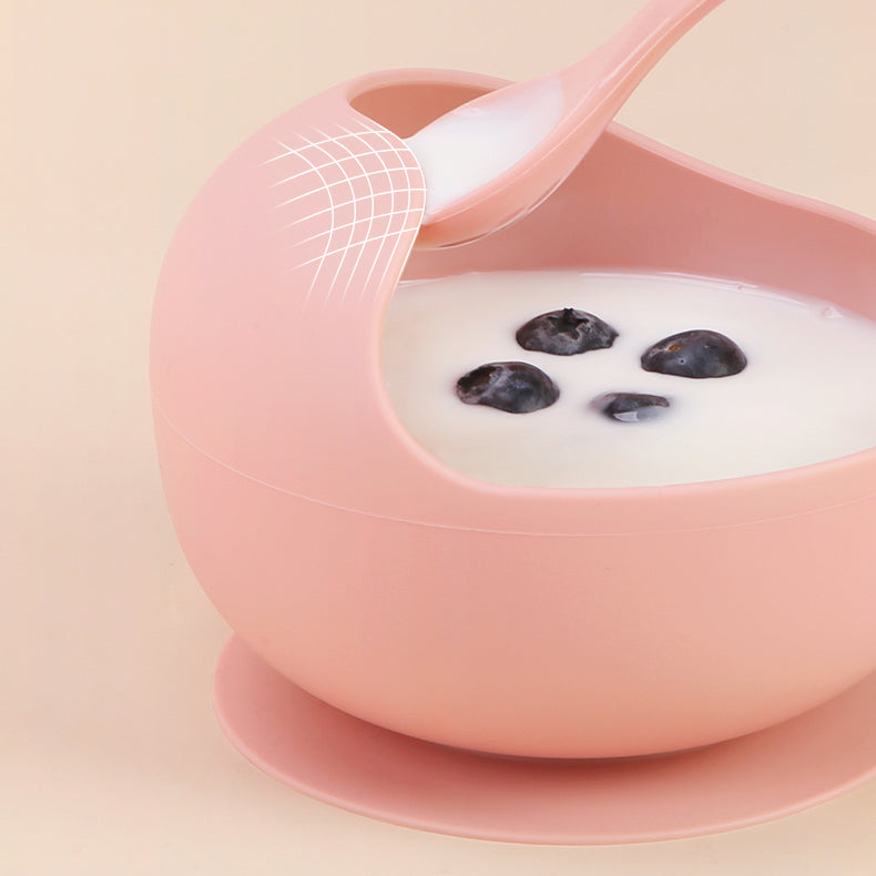 Bowl de silicona rosado con borde curvado para facilitar el aprendizaje de comer solo