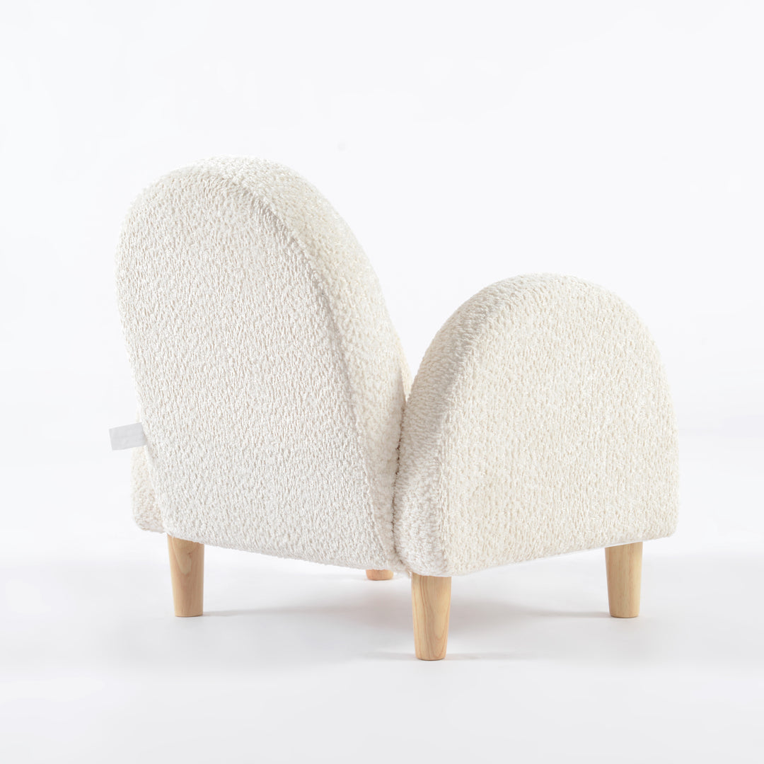 Sillón para niños pequeño vista en ángulo desde atrás tapizado en blanco, mueble infantil cómodo y decorativo