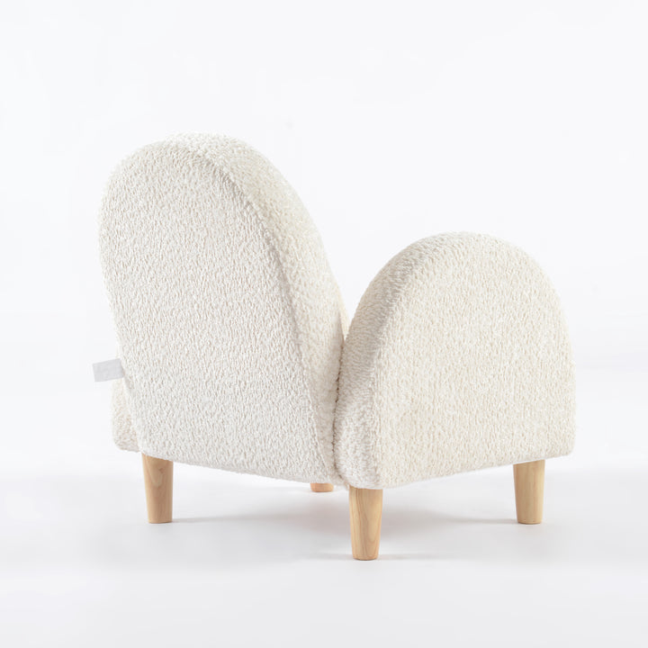 Sillón para niños pequeño vista en ángulo desde atrás tapizado en blanco, mueble infantil cómodo y decorativo