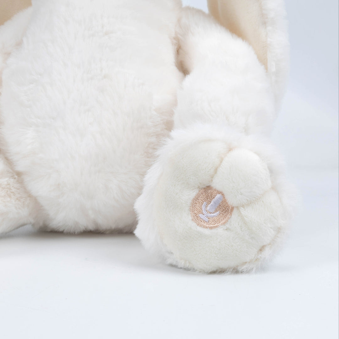 Conejo musical de apego blanco Roots Toys, peluche para calmar al bebé