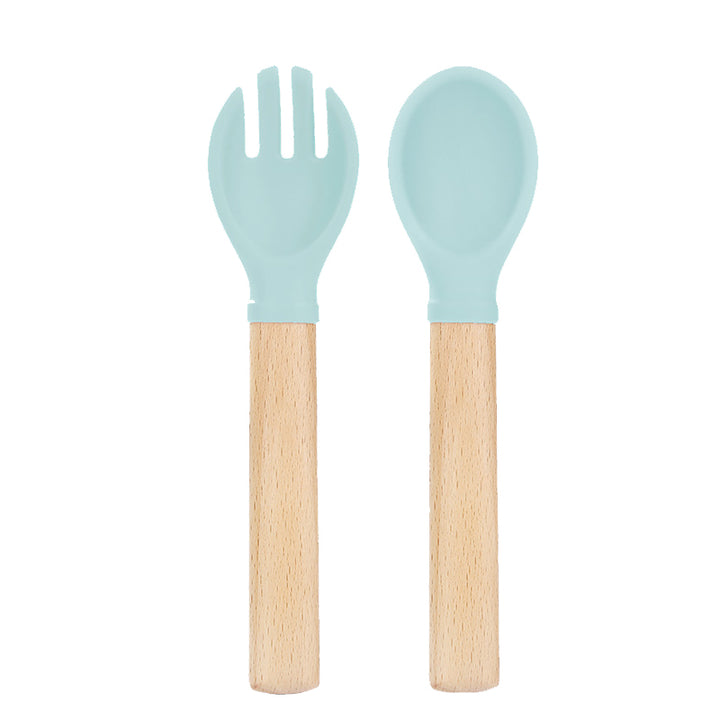Set de cuchara y tenedor de silicona verde menta con mango de madera para bebé