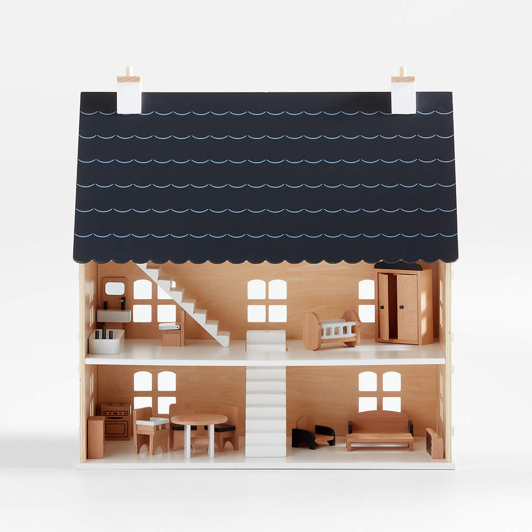 Casa de muñecas de madera con interior amoblado, tres pisos y accesorios de mobiliario en miniatura.