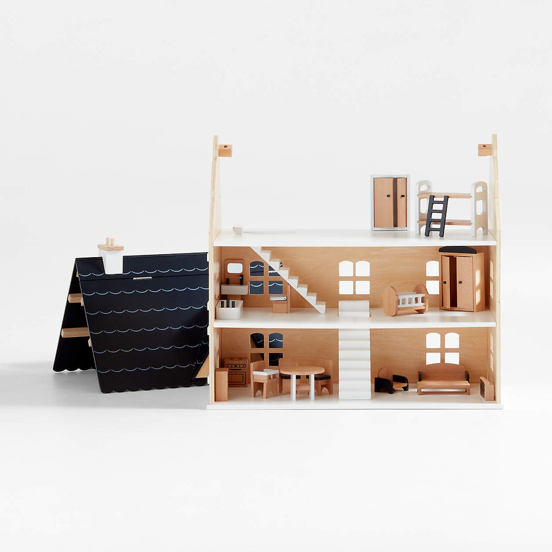 Casa de muñecas de madera de tres pisos con techo abatible y estructura interior, incluyendo escaleras y mobiliario de madera.